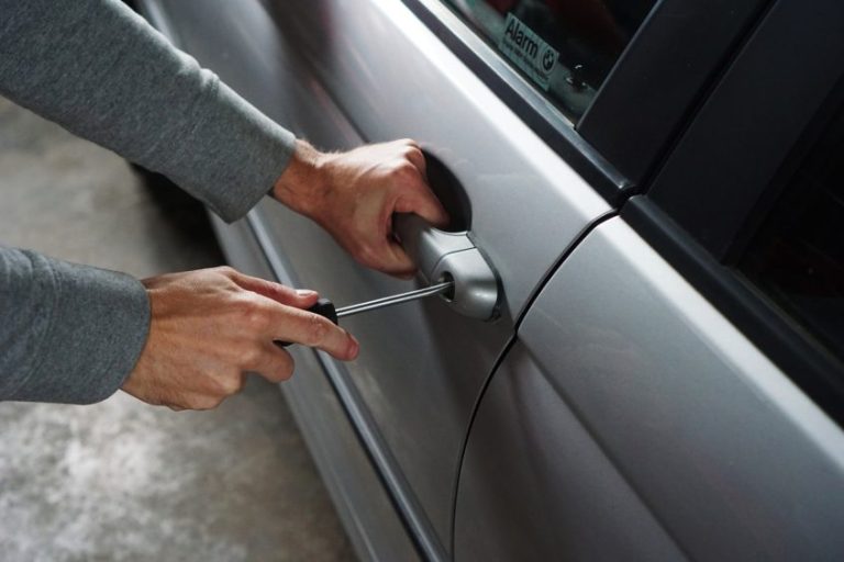 Person breaking into car