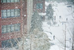 snowy city street during a winter storm